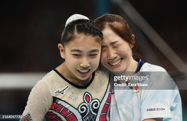 Rina Kishi of Team Japan during the reacts with her coach Risa Toyoshima after finishing her routine on the uneven bars Artistic Gymnastics Women's...