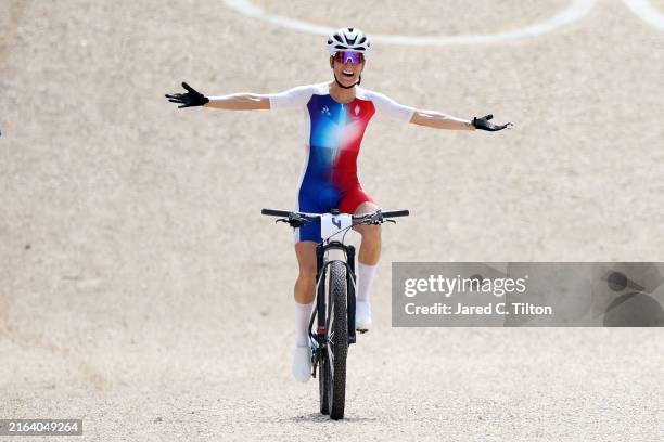 Pauline Ferrand Prevot of Team France celebrates at finish line as race winner during the Women’s Cross-Country Cycling Mountain Bike Gold Medal race...