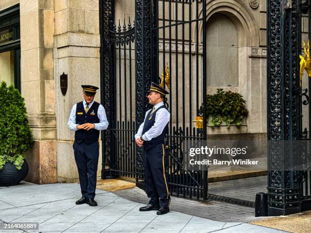 doormen standing on sidewalk, nyc - doorman stock pictures, royalty-free photos & images