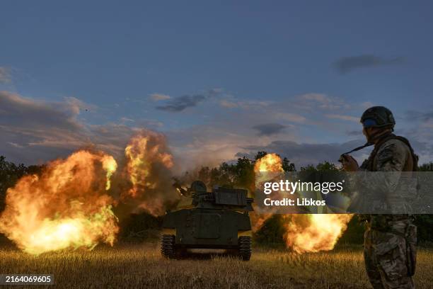 Soldiers fire a 2C1 "Carnation" - Soviet 122-mm regimental self-propelled artillery installation, the world's first serial floating tracked...