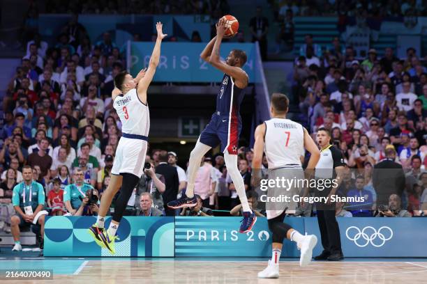 Kevin Durant of Team United States shoots the ball against Filip Petrusev of Team Serbia during the first half of the Men's Group Phase - Group C...