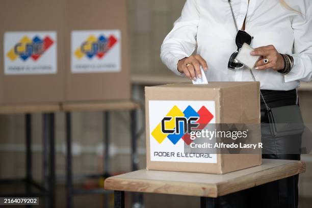 Woman casts her vote during the presidential election on July 28, 2024 in Caracas, Venezuela. Venezuelans go to polls amid a controversial election....