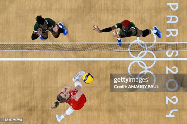 This overview taken on July 31, 2024 shows Poland's Klaudia Alagierska spiking the ball during the women's preliminary round volleyball match between...