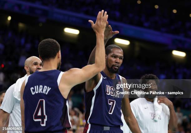 Kevin Durant of United States celebrates with Stephen Curry of United States during the Men's Basketball Group Phase - Group C game between Serbia...