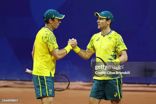 Matthew Ebden and partner John Peers of Team Australia celebrate after winning match point against Hady Habib and Benjamin Hassan of Team Lebanon...