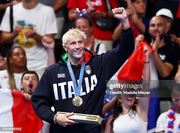 Gold Medalist Nicolo Martinenghi of Team Italy celebrates on the podium during the Swimming medal ceremony after the Men’s 100m Breaststroke Final on...