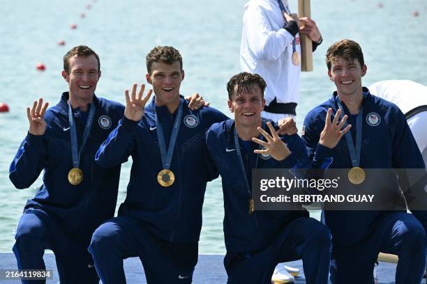 Gold medallists Nick Mead, Justin Best, Michael Grady and Liam Corrigan pose on the podium during the medal ceremony after the men's four final...