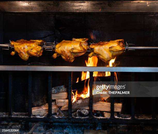 chicken on a spit using wood - rotisserie stock pictures, royalty-free photos & images