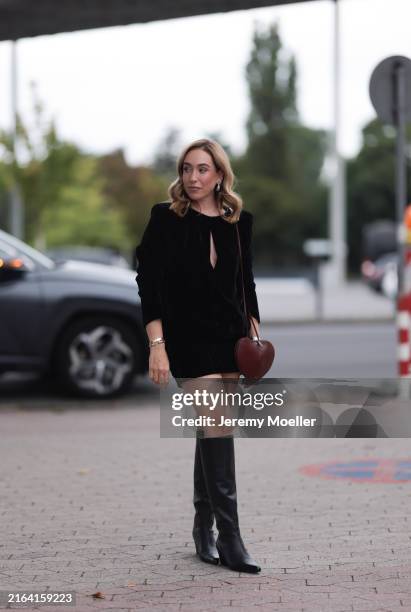 Sonia Lyson seen wearing a Riani black short dress, at RIANI Cruise 2024 on July 27, 2024 in Duesseldorf, Germany.