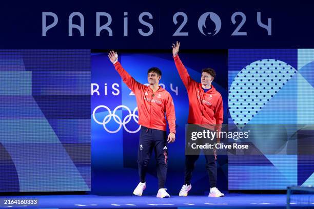 Thomas Daley and Noah Williams of Team Great Britain acknowledge the fans as they walk out ahead of the Men’s Synchronised 10m Platform Final on day...