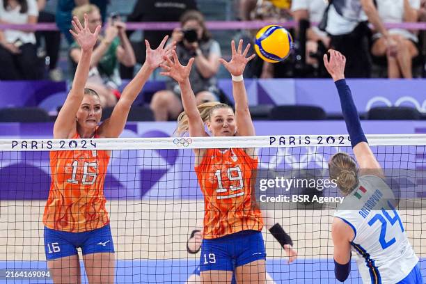 Ekaterina Antropova of Italy throws the ball, Juliet Lohuis of the Netherlands and Nika Daalderop of the Netherlands blocking the ball during the...