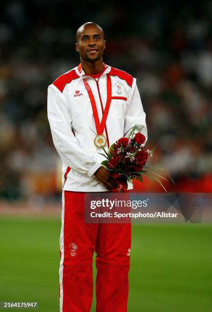 August 22: Nelson Evora of Portugal celebrates during the Olympic Games, Mens Triple Jump Medal Ceremony at Olympic Stadium on August 22, 2008 in...