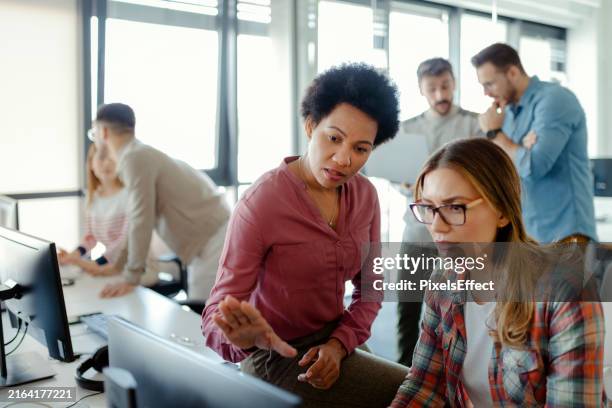 startup company employees working in software development - software development team stock pictures, royalty-free photos & images