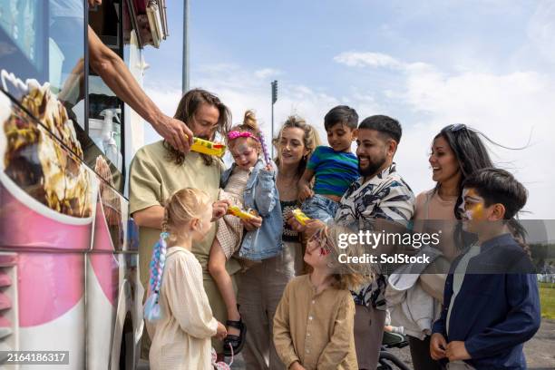 ordering at the ice cream van - kid ice cream truck stock pictures, royalty-free photos & images
