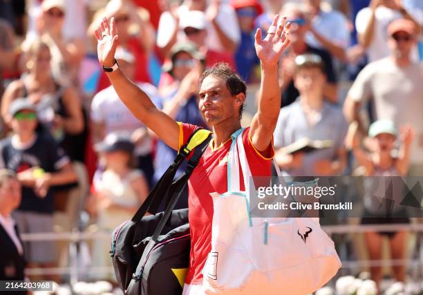 Rafael Nadal of Team Spain acknowledges the crowd after losing to Novak Djokovic of Team Serbia at the end of their the Men's Singles second round...