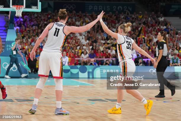 Emma Meesseman and Julie Vanloo of Team Belgium high five during the game against the USA Women's National Team on August 1, 2024 at the Stade Pierre...