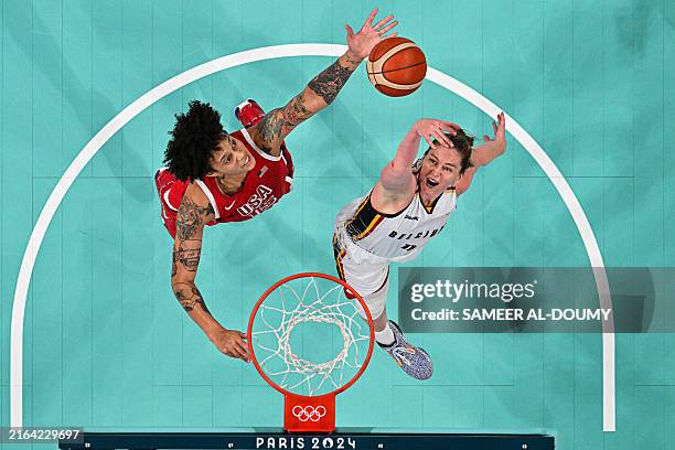 An overview shows USA's Brittney Griner and Belgium's Emma Meesseman go for a rebound in the women's preliminary round group C basketball match...