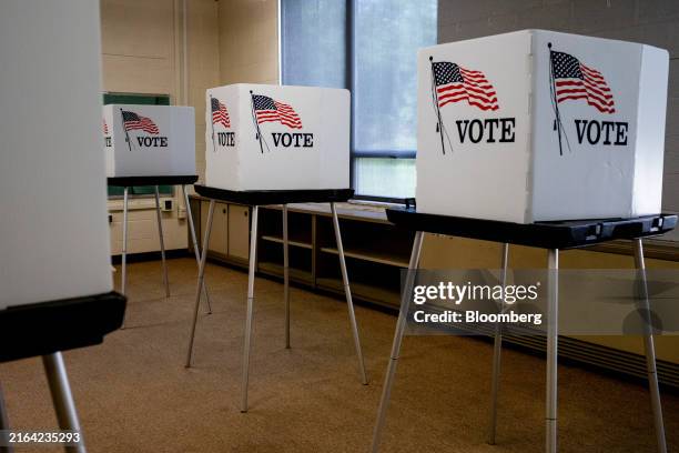 Voting booths at a polling station in Lansing, Michigan, US, on Thursday, Aug. 1, 2024. Three federal judges on Friday approved a new Michigan Senate...