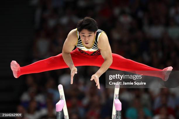 Wataru Tanigawa of Team Japan competes on the parallel bars during the Artistic Gymnastics Men's Team Final on day three of the Olympic Games Paris...