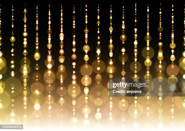 golden string lights background - string lights black background stock illustrations