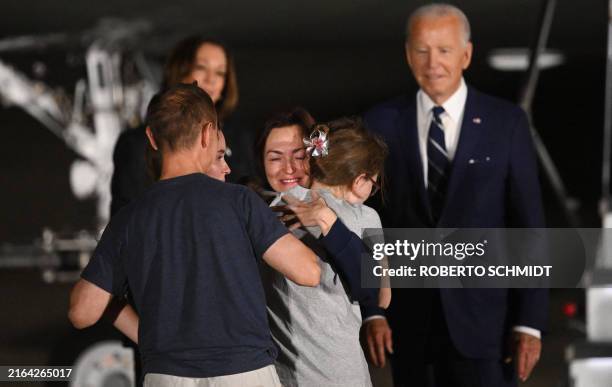 President Joe Biden and Vice President Kamala Harris watch as former prisoner held by Russia US-Russian journalist Alsu Kurmasheva embraces her...