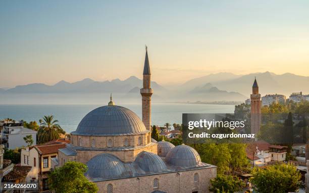 old town antalya, tekeli mehmet pasa mosque and yivli (fluted) minaret at sunset, antalya, turkey - moské bildbanksfoton och bilder