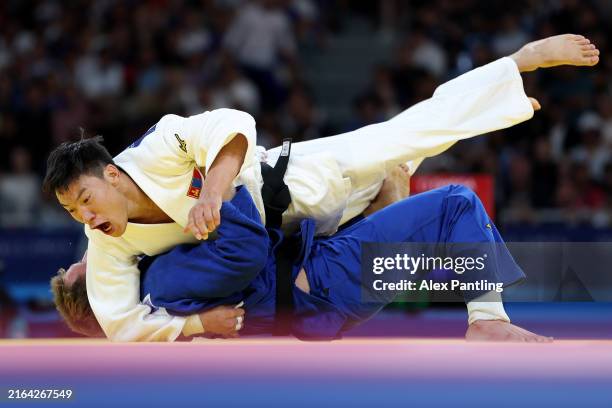 Erdenebayar Batzaya of Team Mongolia and Salvador Cases Roca of Team Spain compete in the Judo Men -73kg Elimination Round of 16 on day three of the...