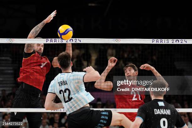 Germany's Gyoergy Grozer and Germany's Tobias Krick vie with Argentina's Nicolas Zerba and Argentina's Santiago Danani during the men's preliminary...