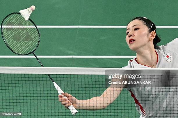 Shida Racket Japan's Chiharu Shida plays a shot in the women's doubles badminton ...