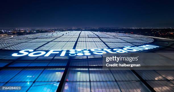 aerial view of sofi stadium roof with la cityscape - sponsorship stock pictures, royalty-free photos & images