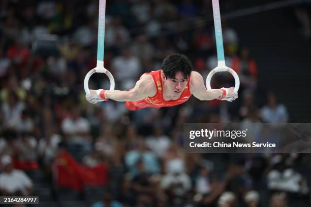 Zhang Boheng of Team China competes in the Rings event of Artistic Gymnastics during the Men's Team Final on day 3 of the Paris 2024 Olympic Games at...