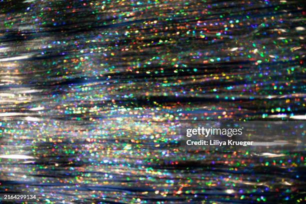 tinsel holiday background. - tinsel stock pictures, royalty-free photos & images