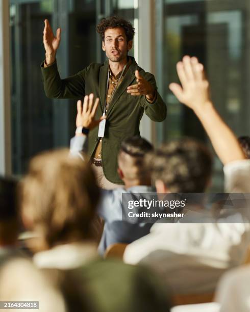 engaging seminar in the office! - hands raised business stock pictures, royalty-free photos & images