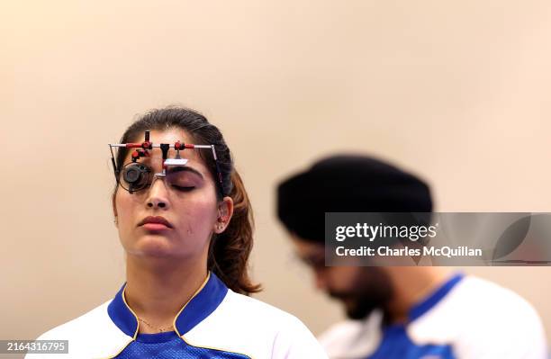 Manu Bhaker of Team India looks on during the Shooting 10m Air Pistol Mixed Team Bronze Medal Match on day four of the Olympic Games Paris 2024 at...