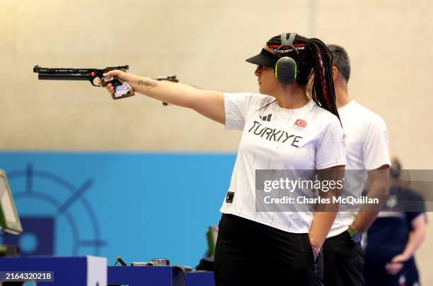 Sevval Ilayda Tarhan of Team Turkiye competes in the Shooting 10m Air Pistol Mixed Team Gold Medal Match against Team Serbia on day four of the...