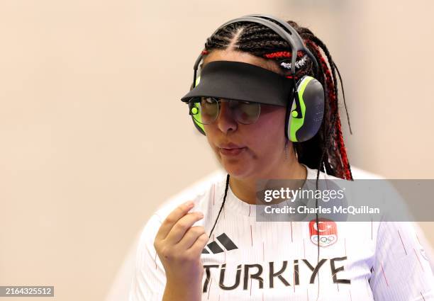 Sevval Ilayda Tarhan of Team Turkiye reacts while competing in the 10m Air Pistol Mixed Team Gold Medal Match against Team Serbia on day four of the...