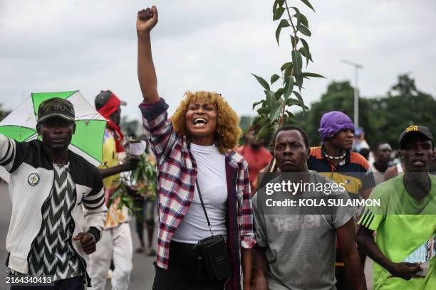 Protestor gestures as she joins others during the End Bad Governance protest in Abuja on August 2, 2024. At least 13 people died during protests over...