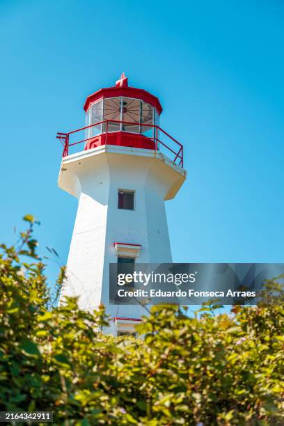 low angle view of the cape gaspé lighthouse - gaspe peninsula stock pictures, royalty-free photos & images