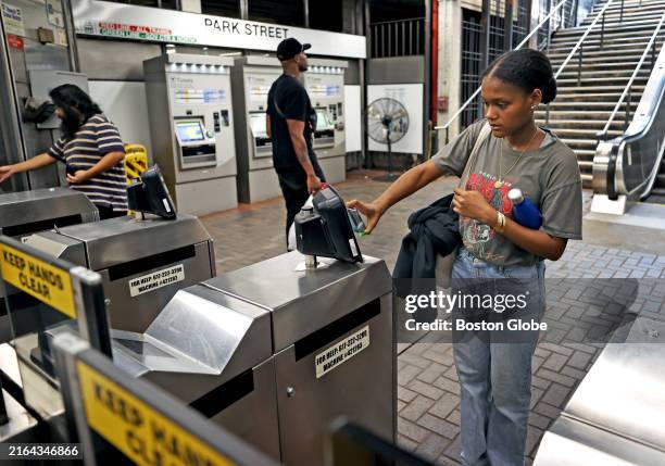 Boston, MA A customer uses the new MBTA tap-to-pay system for the first time at Park Street Station.