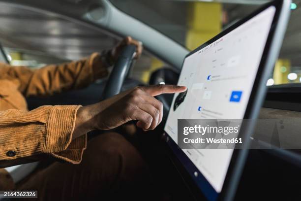 hand of man using touch screen navigation in car - touch screen map stock pictures, royalty-free photos & images