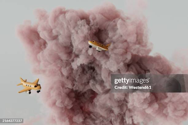 artificial yellow airplanes amidst pink clouds - dramatic light studio stock illustrations