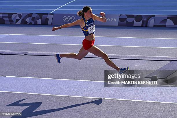 Romania's Elena Andreea Talos competes in the women's triple jump qualification of the athletics event at the Paris 2024 Olympic Games at Stade de...