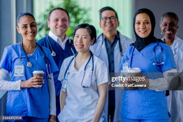 medical team portrait - pediatric medical consult hijab stock pictures, royalty-free photos & images