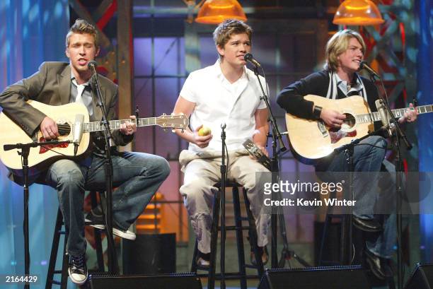 Hanson with band members Isaac, Zac and Taylor perform on "The Tonight Show with Jay Leno" at the NBC Studios on July 15, 2003 in Burbank, California.