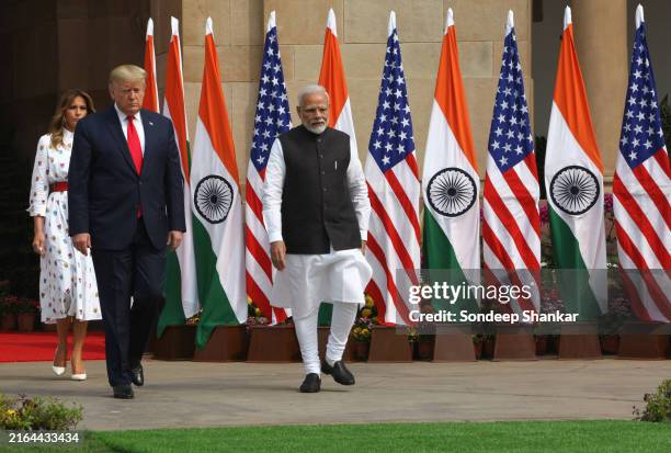 President Donald Trump, first lady Melania Trump and Indian Prime Minister Narendra Modi walk for a photo-op before their meeting at Hyderabad House,...