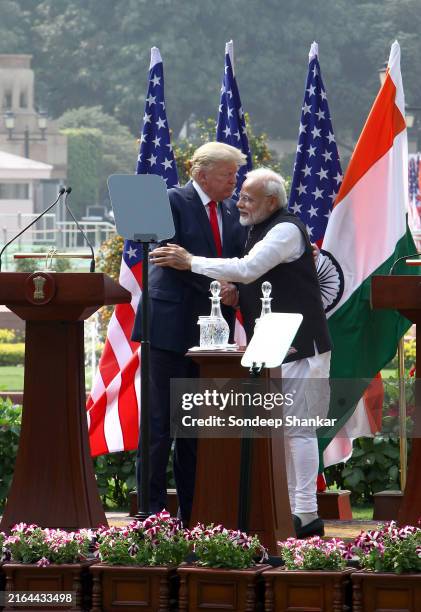 President Donald Trump and Indian Prime Minister Narendra Modi embrace each other after addressing. A media interaction in New Delhi, India.