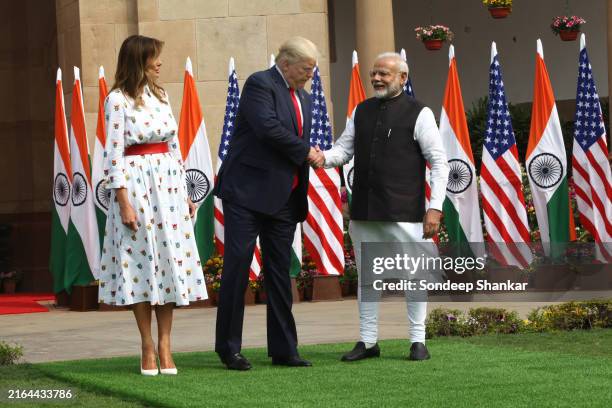 First lady Melania Trump looks on as US president Donald Trump shakes hands with Indian Prime Minister Narendra Modi at Hyderabad House in New Delhi...