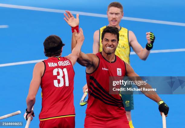 Alexander Hendrickx of Team Belgium celebrates scoring his team's first goal with teammate Arno van Dessel during the Men's Pool B match between...