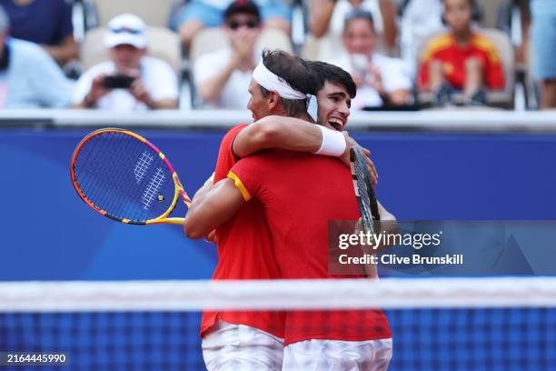 Carlos Alcaraz of Team Spain celebrates with partner Rafael Nadal of Team Spain after winning match point against Tallon Griekspoor of Team...