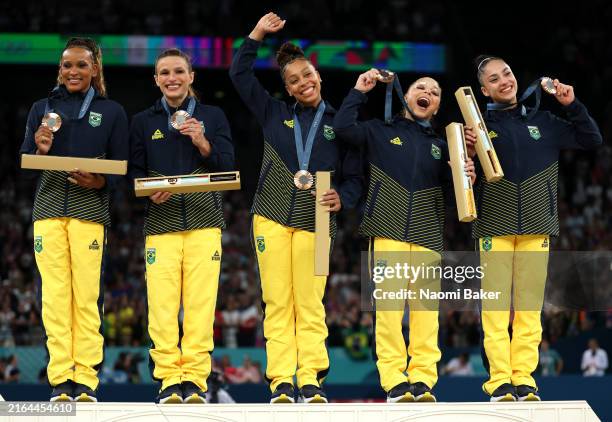 Bronze medalists Team Brazil celebrate on the podium during the medal ceremony for the Artistic Gymnastics Women's Team Final on day four of the...
